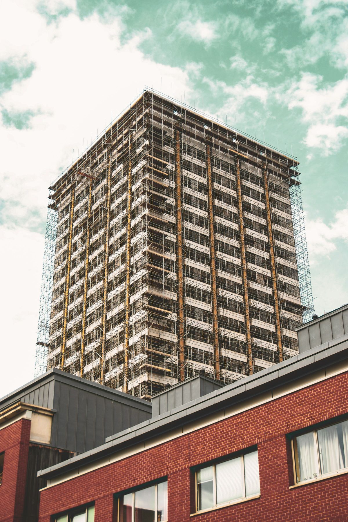 Tower block wrapped in scaffolding